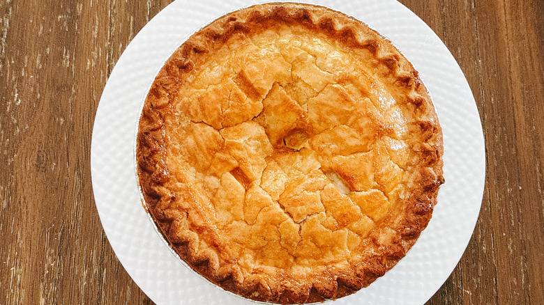 Publix small apple pie on white plate on wooden table