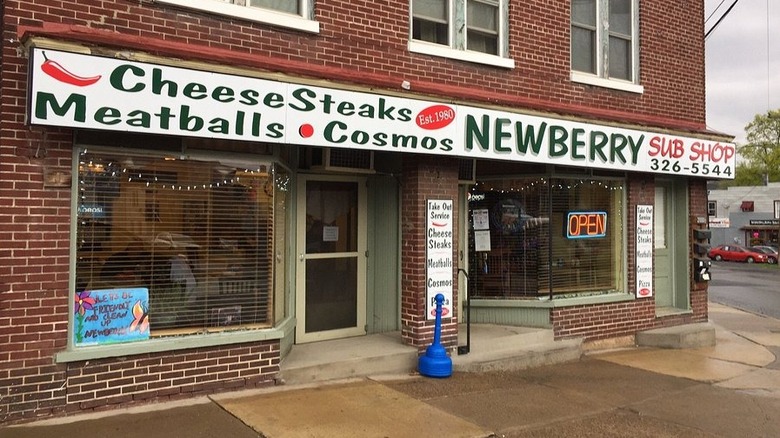 A sign for Newberry sub shop in Williamsport, featuring cosmos