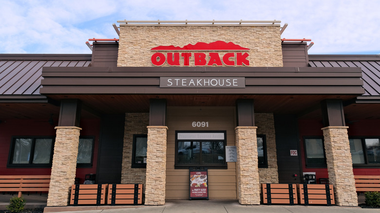 Exterior of an Outback Steakhouse restaurant during daytime