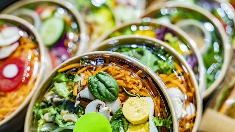 Pre-packaged vegetable salads displayed