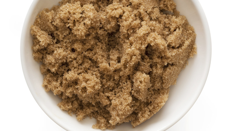 Close-up view of brown sugar in a white bowl