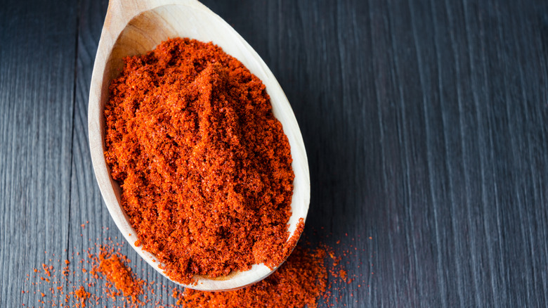 Smoked paprika in a wooden spoon