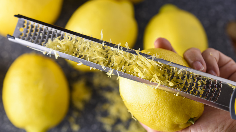 Hand zesting fresh lemon
