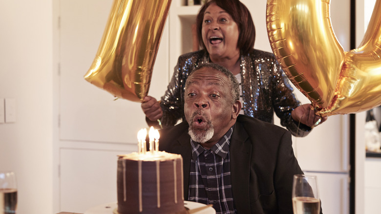 Couple enjoying a birthday with cake