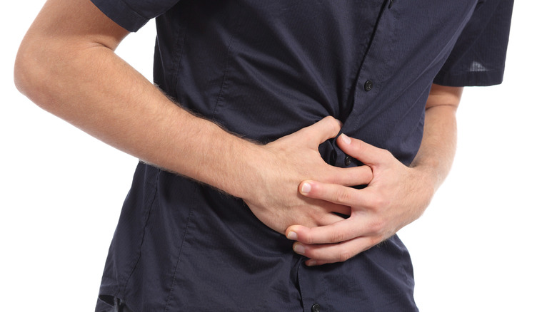 Man suffering from stomach issues