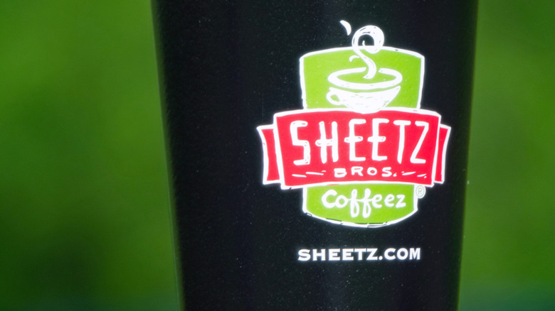 A large black Sheetz coffee cup with the logo on the front