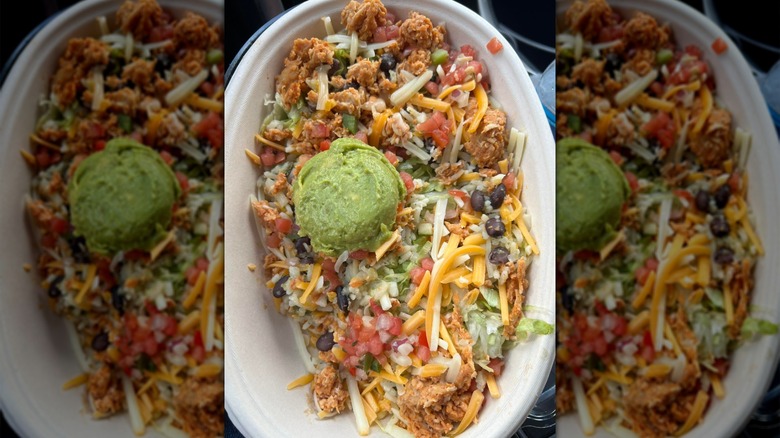 A top view of a Sheetz burrito bowl loaded with toppings like guacamole