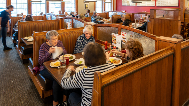 Patrons eating in booth at Bob Evans restaurant