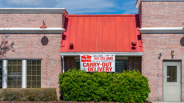 A Bob Evans restaurant with a large sign emphasizing Carry-Out & Delivery services.