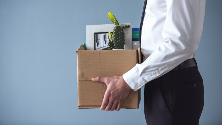 Someone carrying a box after being let go