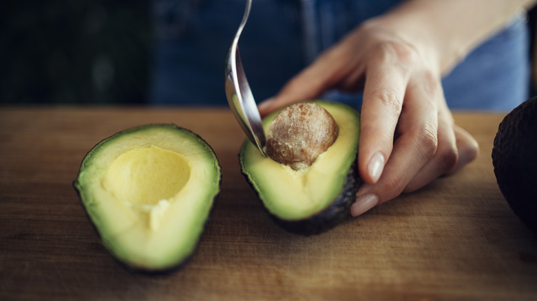 Removing pit from avocado