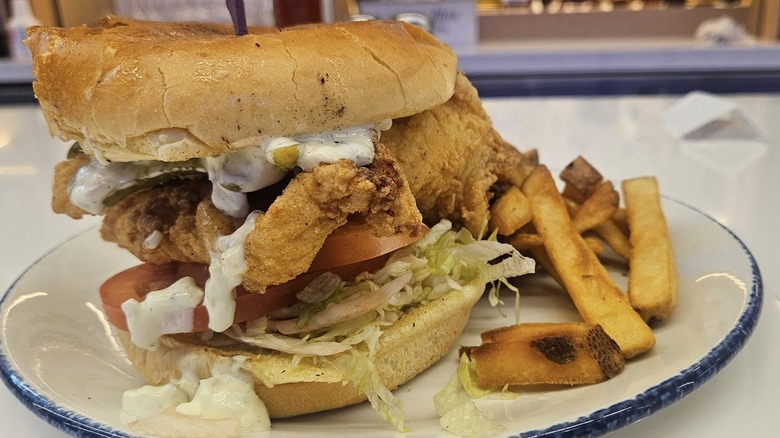 Legal Sea Foods beer battered fish sandwich with fries.