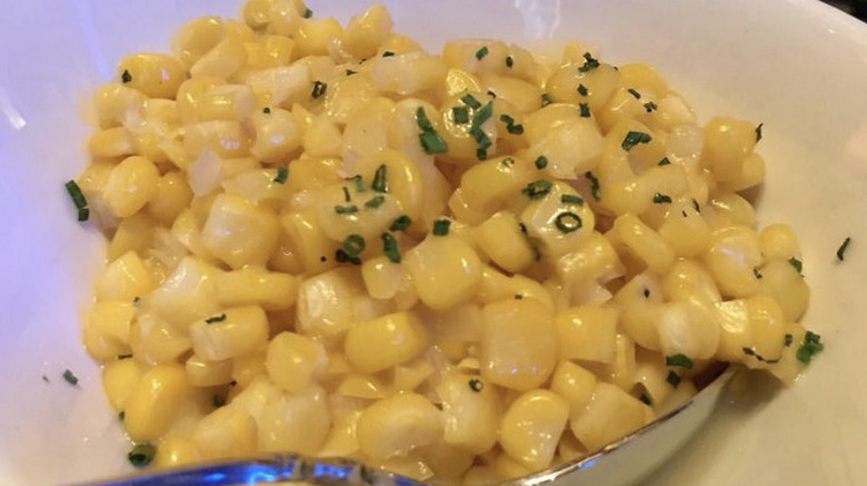 Ocean Prime's Chophouse Corn in silver spoon in white dish
