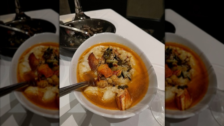 Mastro's lobster mashed potatoes in white bowl with silver serving spoon