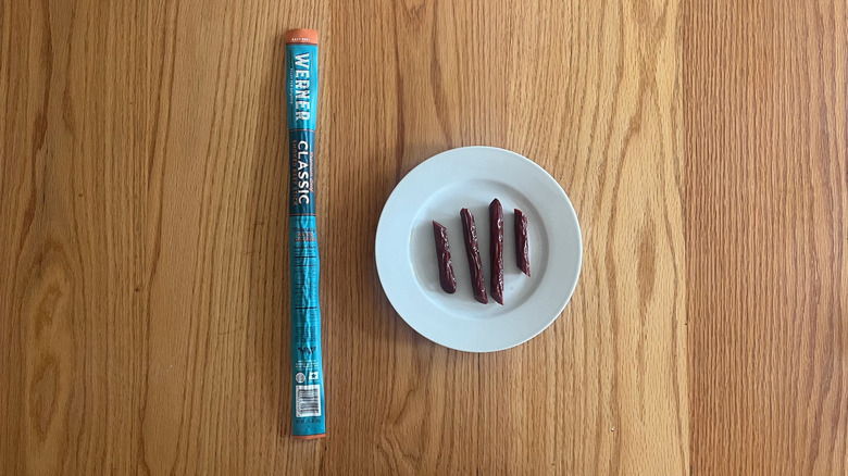 A Werner beef stick cut up on a plate