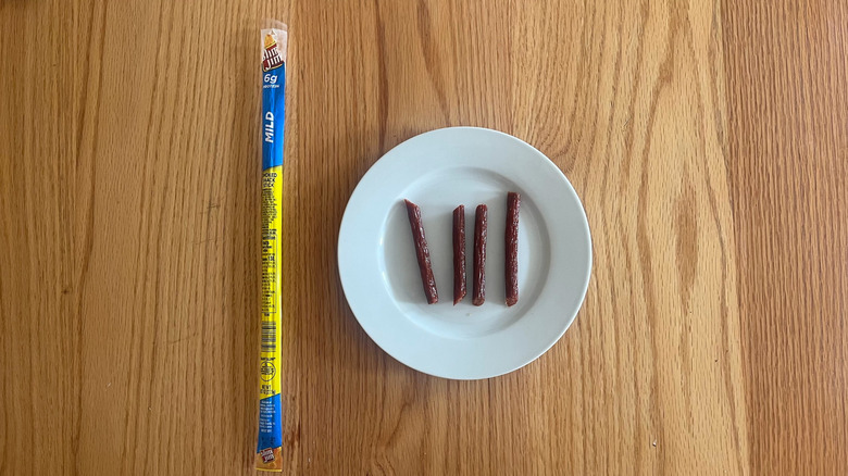 A Slim Jim wrapper next to a plate