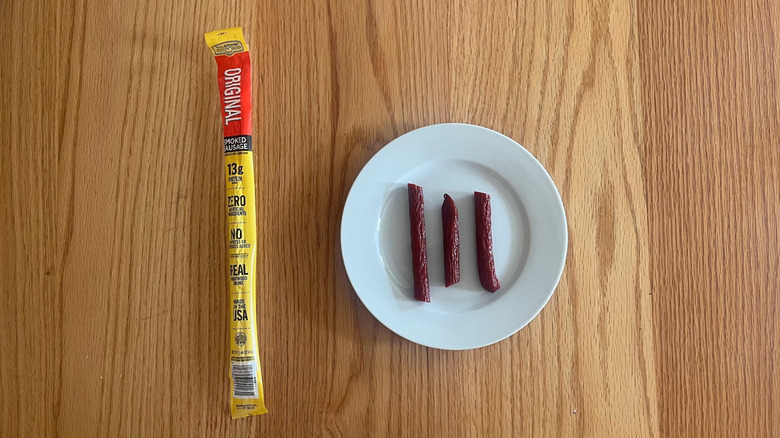 Tillamook meat stick cut into pieces on a plate