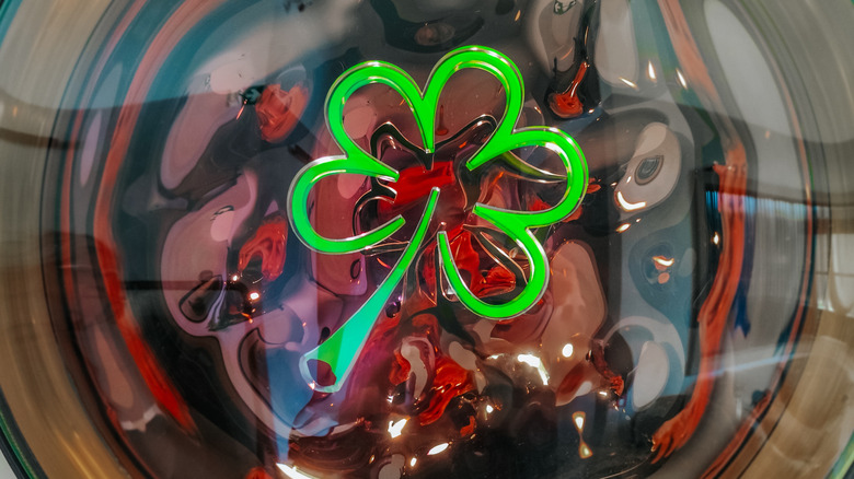 The Green Michelin star neon green clover symbol