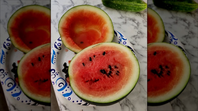 Sugar Baby watermelon cut in half with one half scooped out