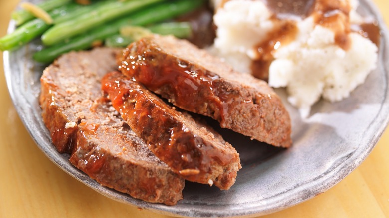 Hearty old fashioned meatloaf dinner with sides