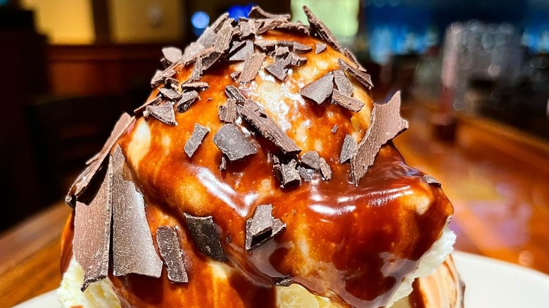 The top of Outback Steakhouse's "gluten-friendly" Thunder From Down Under, with ice cream covered in chocolate flakes and chocolate sauce