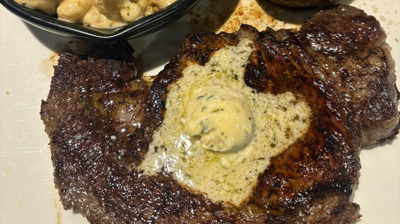 An Outback Steakhouse steak covered in butter