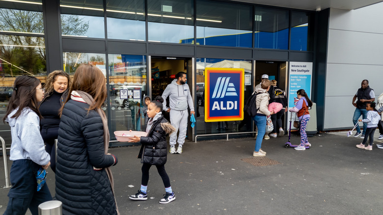 Customers going in and out of Aldi