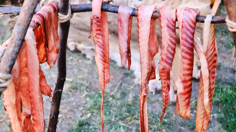 Bacon being smoked outdoors