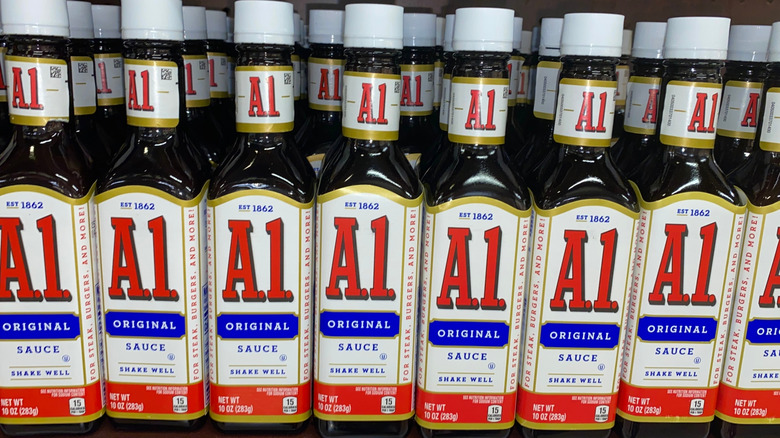 Bottles of A.1. Original steak sauce lined up on a store shelf