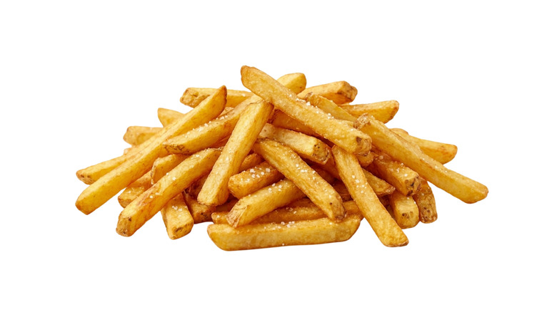 A pile of salted french fries on a white background