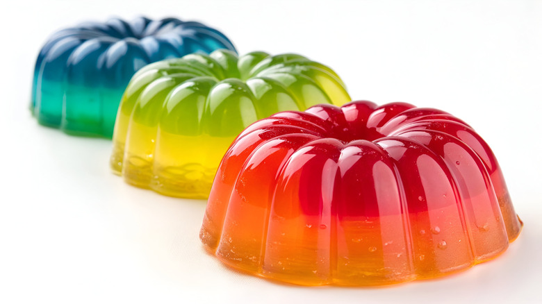 Red, green, and blue gelatin molds lined up in a row