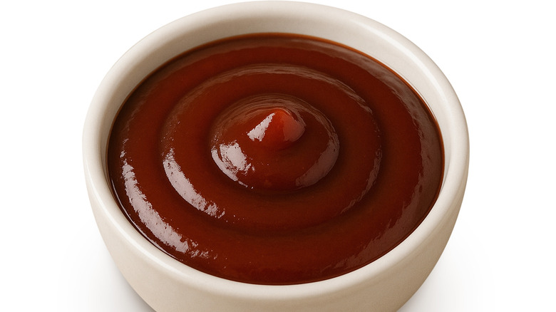 A white bowl of barbecue sauce