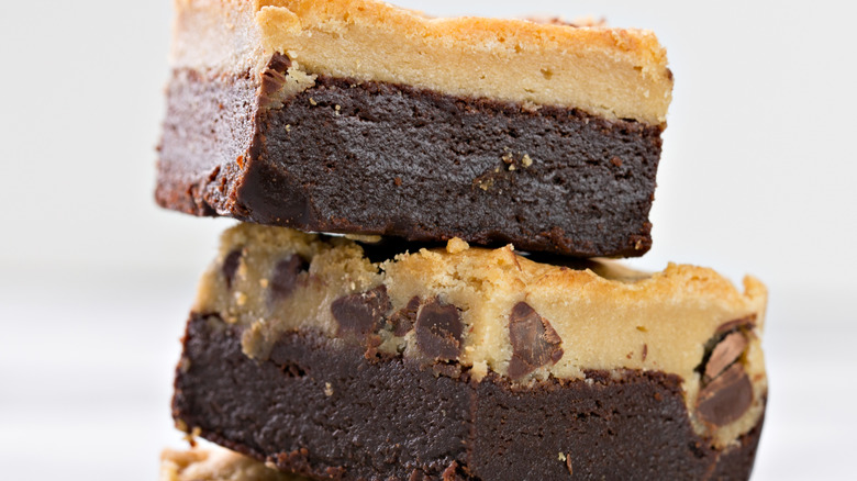 stack of three brookies with crumbs