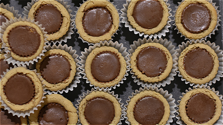 bunch of cookie cups filled with peanut butter cups