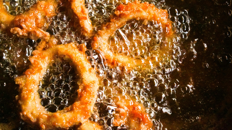 calamari rings being cooked in hot oil