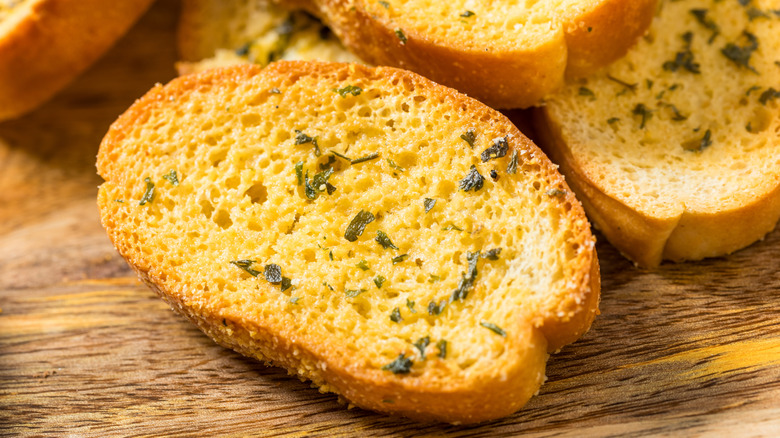 Garlic bread on a cutting board