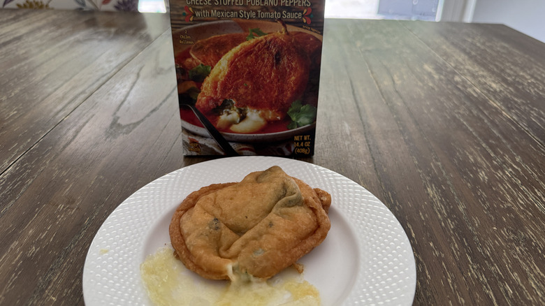Package of Trader Joe's chiles rellenos con queso and one on a white plate