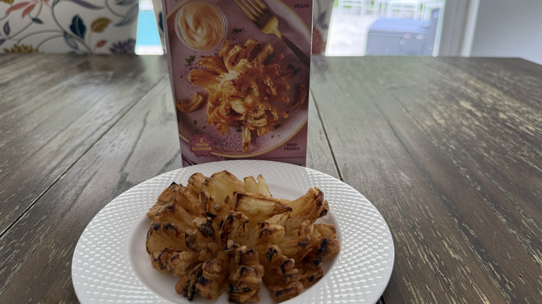 Package of Trader Joe's onion flowers on wooden table and some on a white bowl