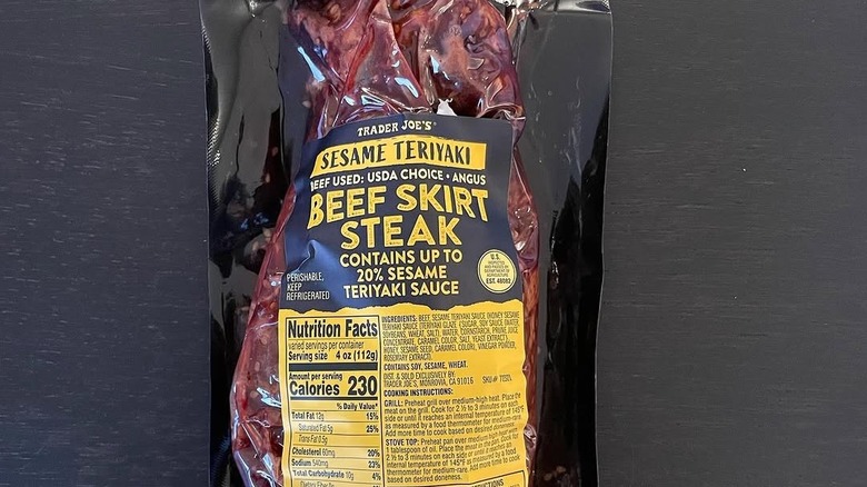 Trader Joe's teriyaki skirt steak on a black background