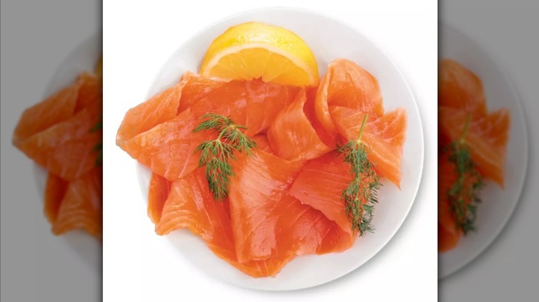 Specially Selected smoked salmon on a white plate with a lemon wedge