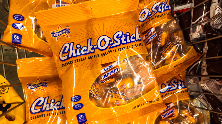 Orange bags of Chick-O-Stick candies in pile at store