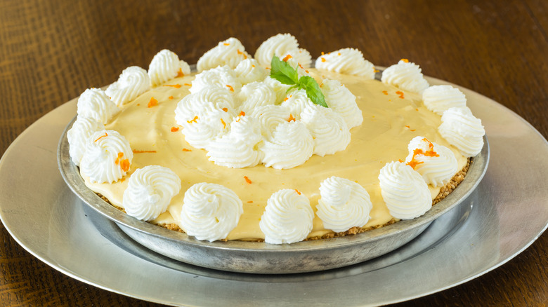 Decorated lemon chiffon pie in silver tray