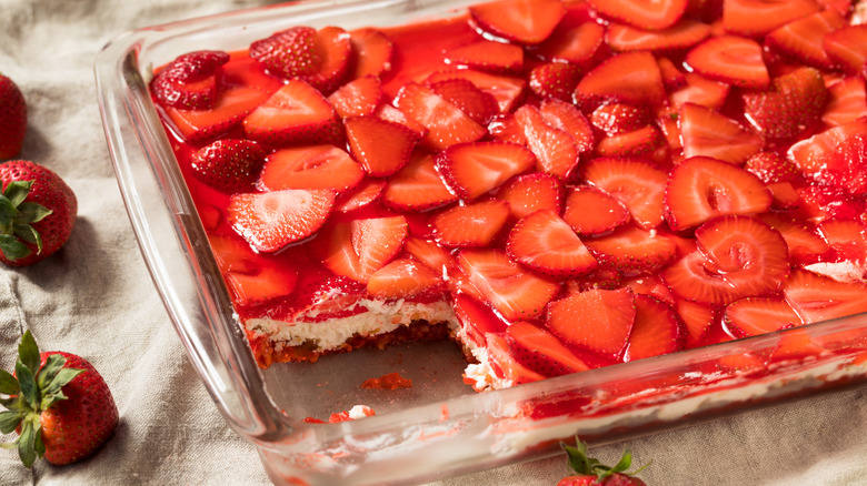 Closeup of strawberry pretzel salad with slice missing