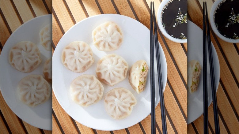 plate of Great Value soup dumplings with chopsticks and a side of soy sauce
