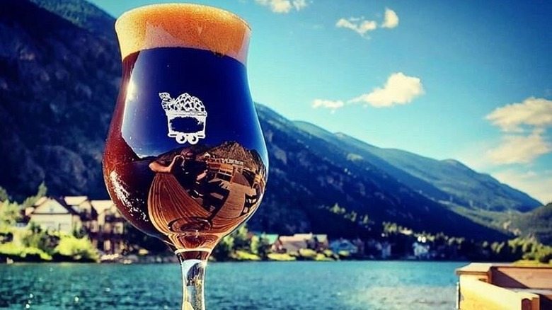 Waterfront view with glass of beer in the foreground