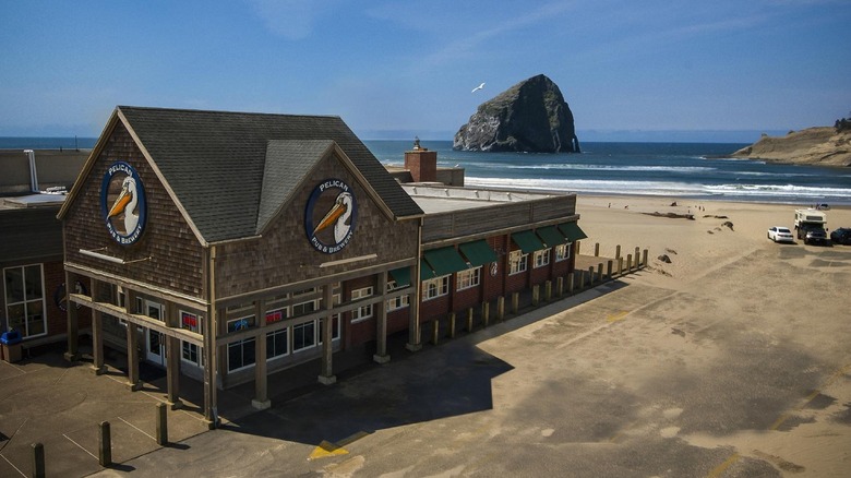 Wide exterior of Pelican Brewing in Oregon, on the beach