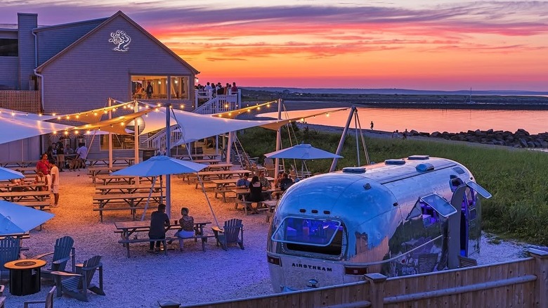 Exterior of Tree House Brewing Co. against a Cape Cod sunset