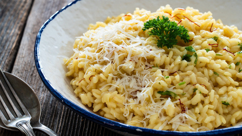 A blue and white bowl of risotto