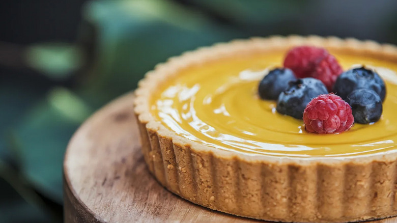 Tart topped with lemon curd and fresh berries