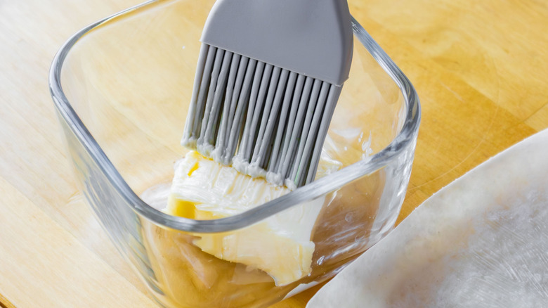 Butter in a bowl with a brush